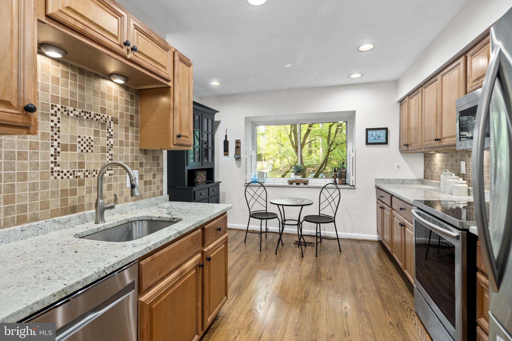 11740 Decade Court Reston, VA 20191 - Photo 6 of 44 Mosaic backsplash & deep sink w/ gooseneck faucet