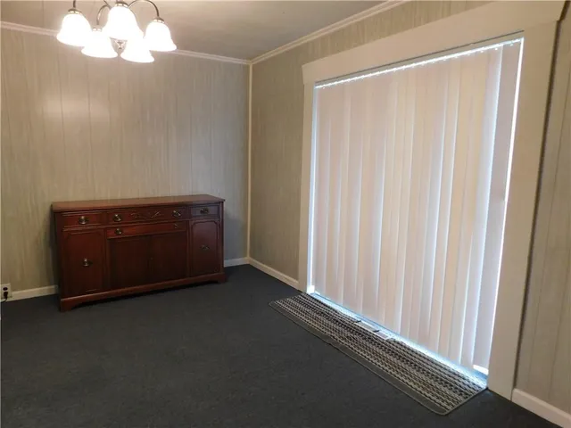 a room with a large mirror and a shower