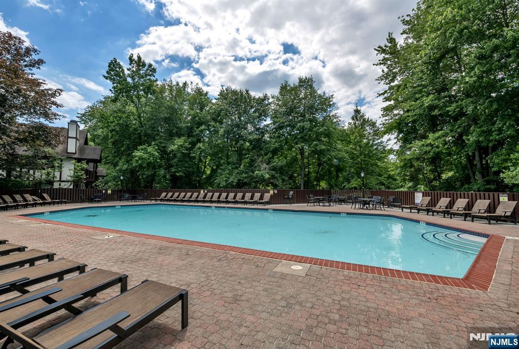 707 Thoreau Court Mahwah, NJ 07430 - Photo 13 of 15 a view of a swimming pool with a yard