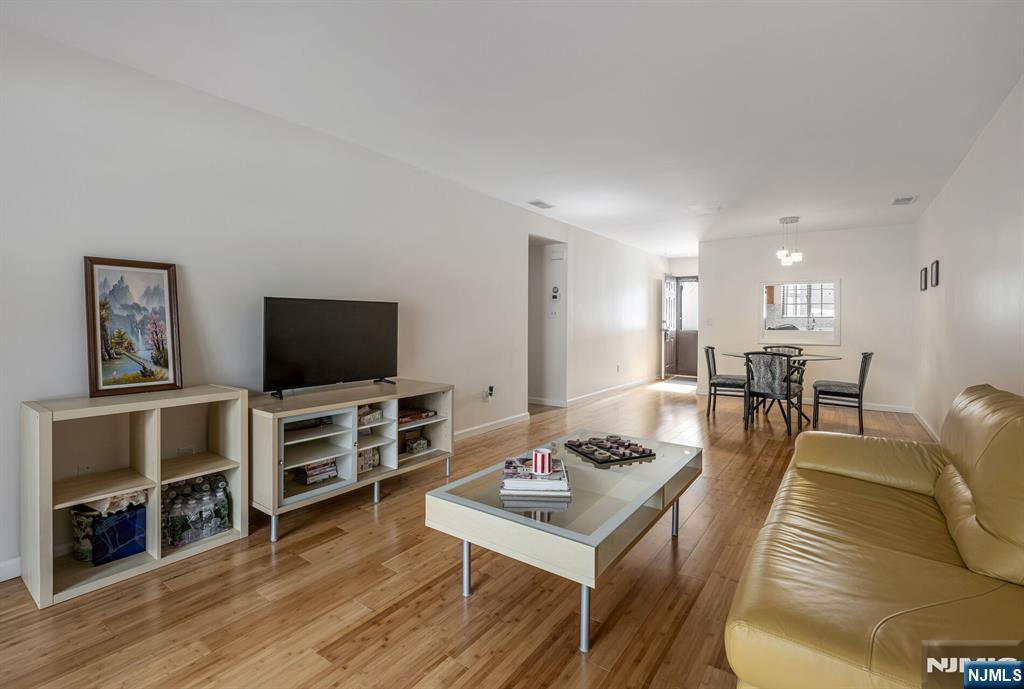 707 Thoreau Court Mahwah, NJ 07430 - Photo 6 of 15 a living room with furniture and a flat screen tv