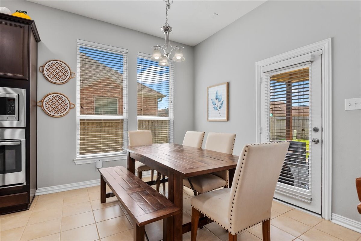 16319 Denise Terrace Drive Hockley, TX 77447 - Photo 20 of 49 a view of a dining room with furniture and window