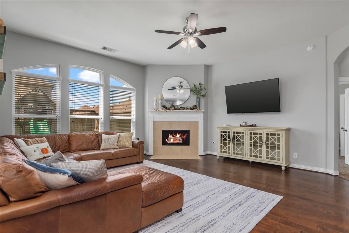 16319 Denise Terrace Drive Hockley, TX 77447 - Photo 22 of 49 a living room with furniture a fireplace and a flat screen tv