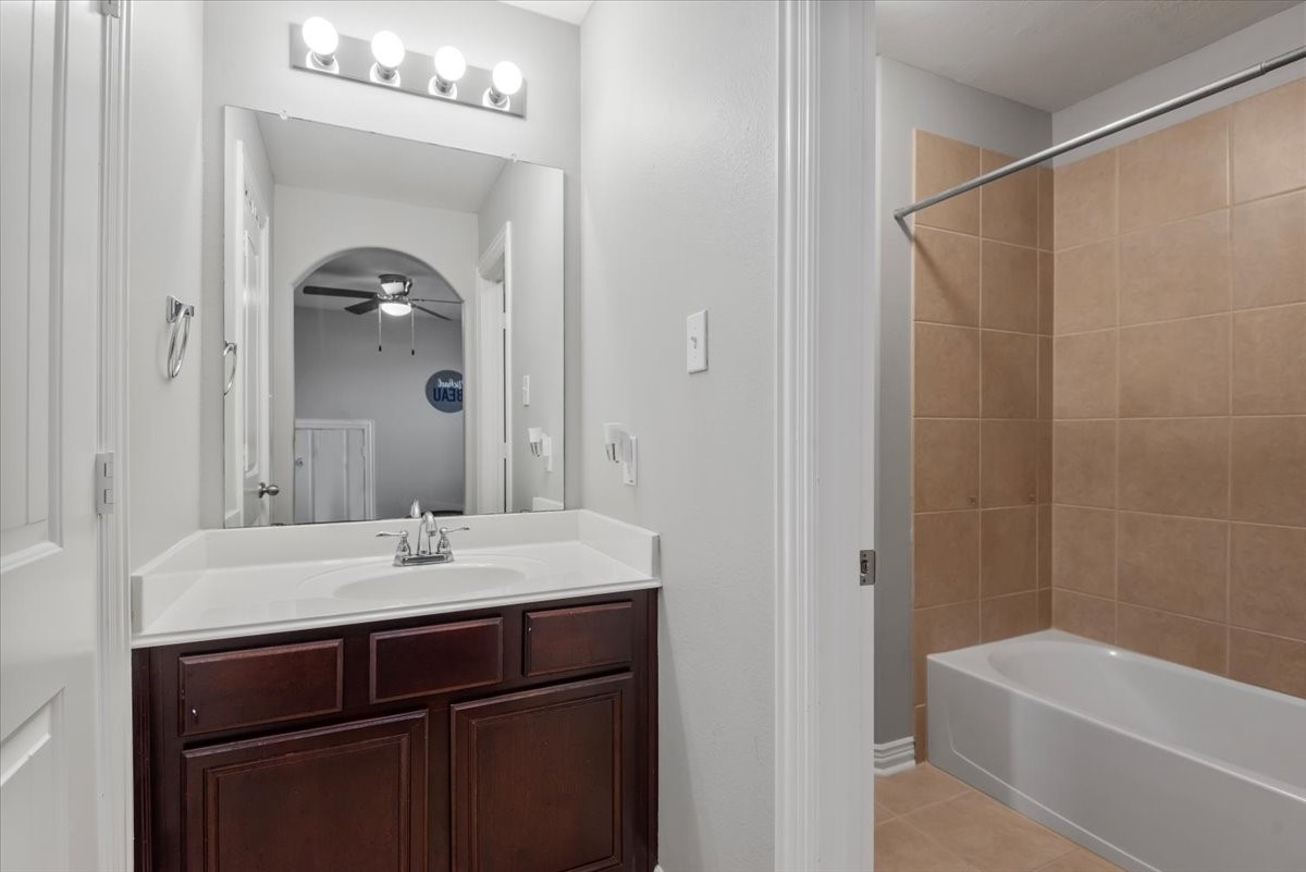 16319 Denise Terrace Drive Hockley, TX 77447 - Photo 37 of 49 a bathroom with a sink and a mirror