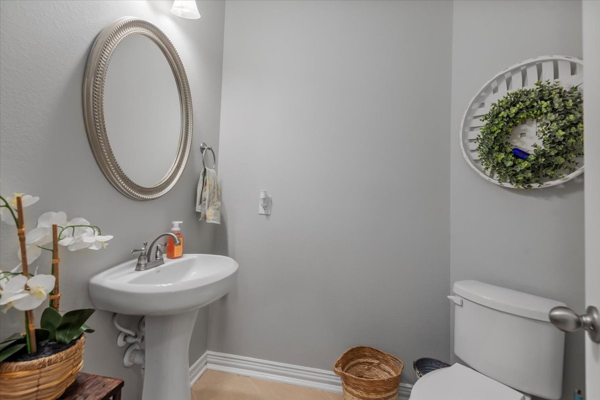 16319 Denise Terrace Drive Hockley, TX 77447 - Photo 41 of 49 a bathroom with a sink mirror and toilet