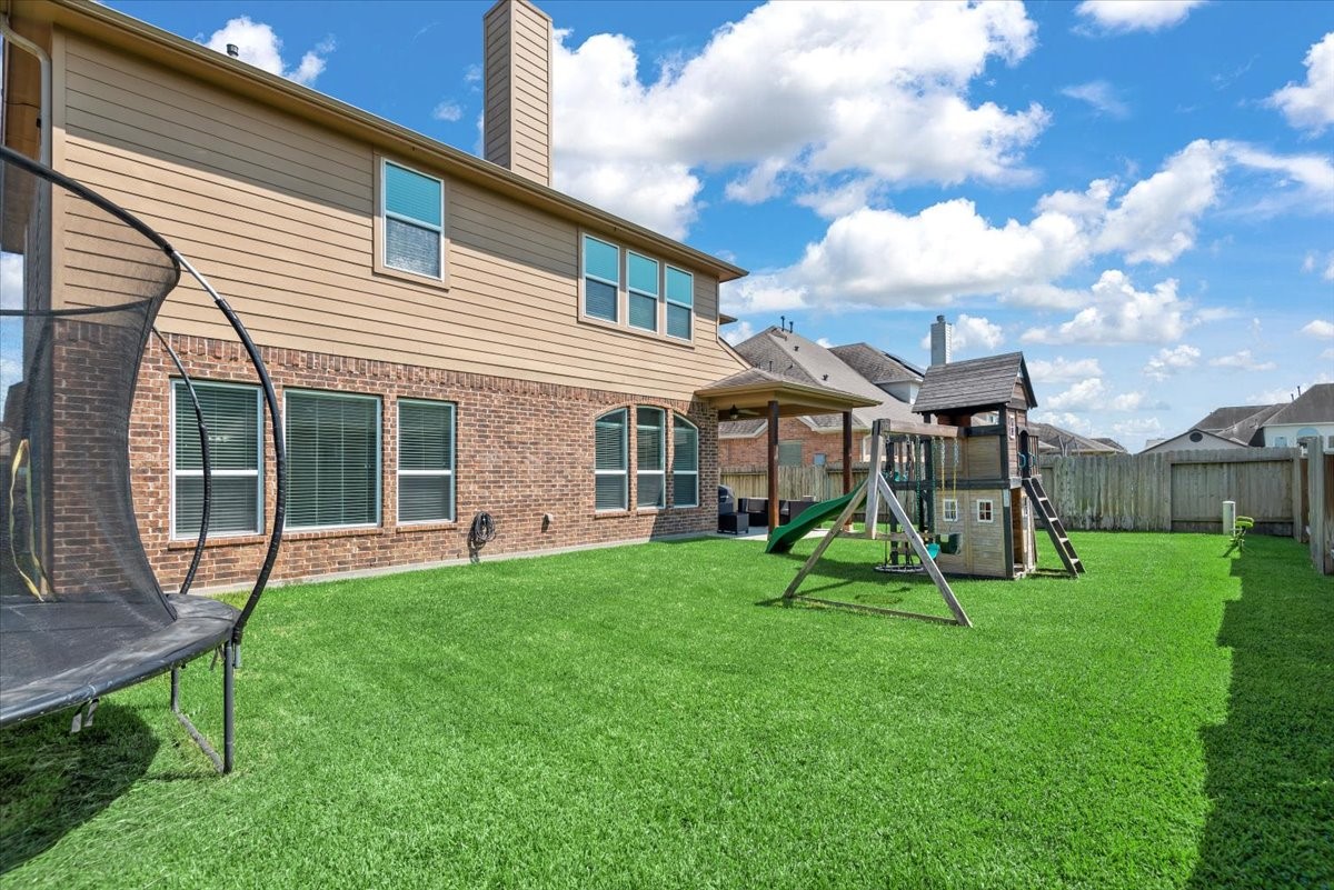 16319 Denise Terrace Drive Hockley, TX 77447 - Photo 42 of 49 a view of a house with a backyard