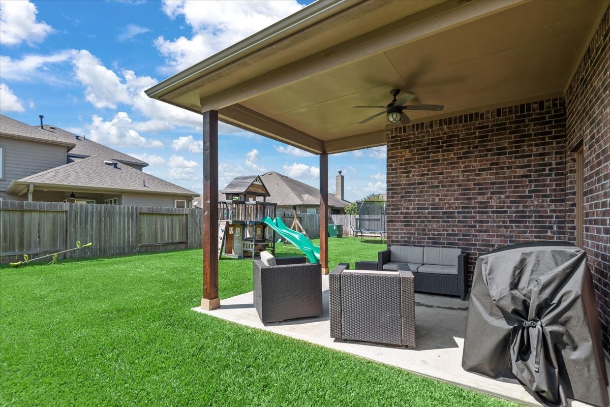 16319 Denise Terrace Drive Hockley, TX 77447 - Photo 43 of 49 a view of a patio with a table and chairs