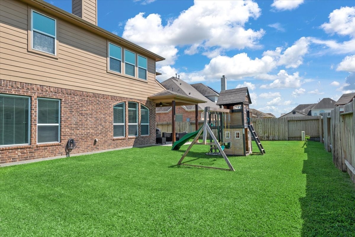 16319 Denise Terrace Drive Hockley, TX 77447 - Photo 45 of 49 a view of a house with a backyard and porch