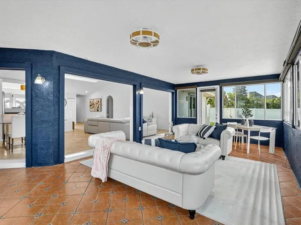 a living room with furniture and a table