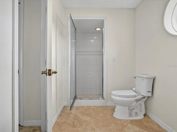 a bedroom with double bed and a window