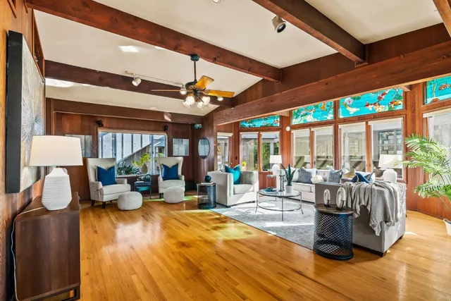 a view of a living room with furniture and window
