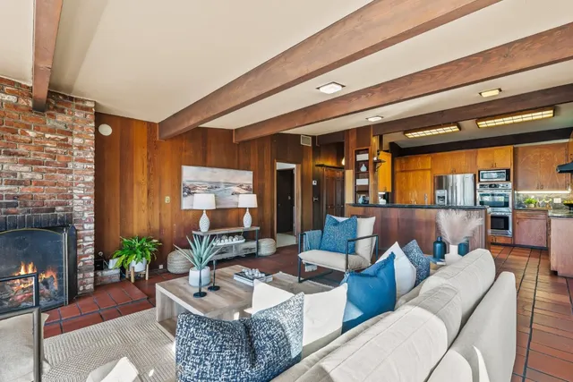 a kitchen with stainless steel appliances granite countertop a sink and a stove