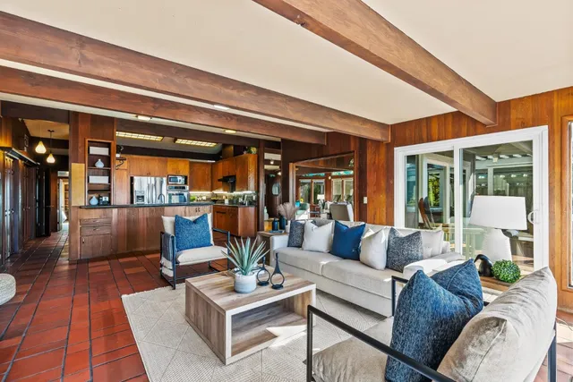 a large bedroom with a large bed and a window