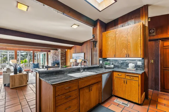 a bedroom with a large bed and a large window