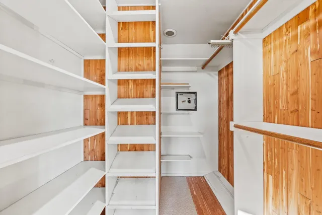 a lobby with furniture and floor to ceiling window