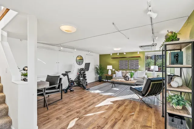 a view of a backyard with plants and garden