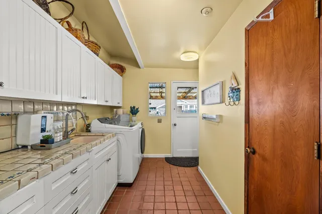 a outdoor living area with furniture and a large window