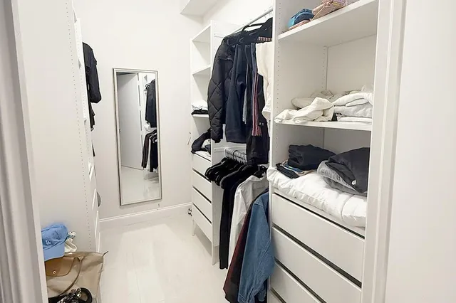 a utility room with closet dryer and washer