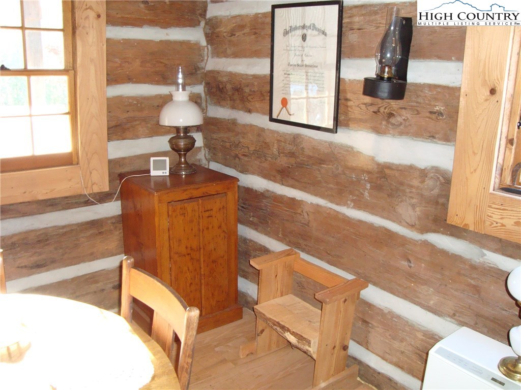4360 Stones Chapel Road Elk Creek, VA 24326 - Photo 11 of 21 a living room with furniture a window and a fireplace