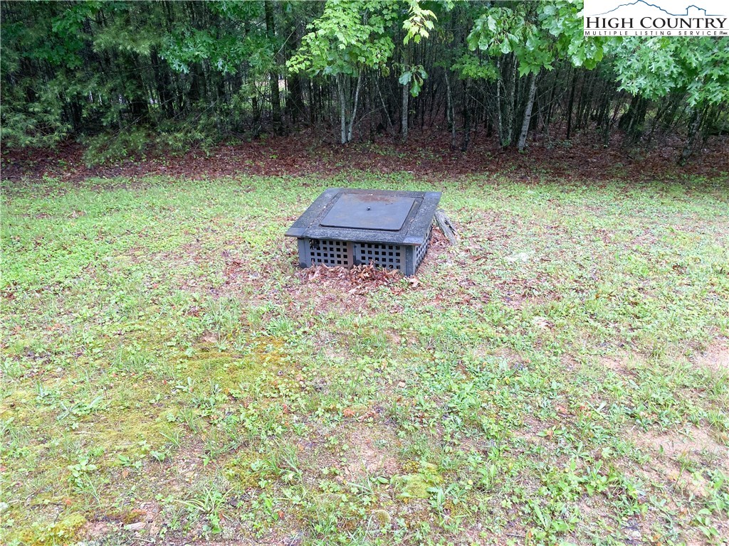 4360 Stones Chapel Road Elk Creek, VA 24326 - Photo 19 of 21 a backyard of a house with lots of green space