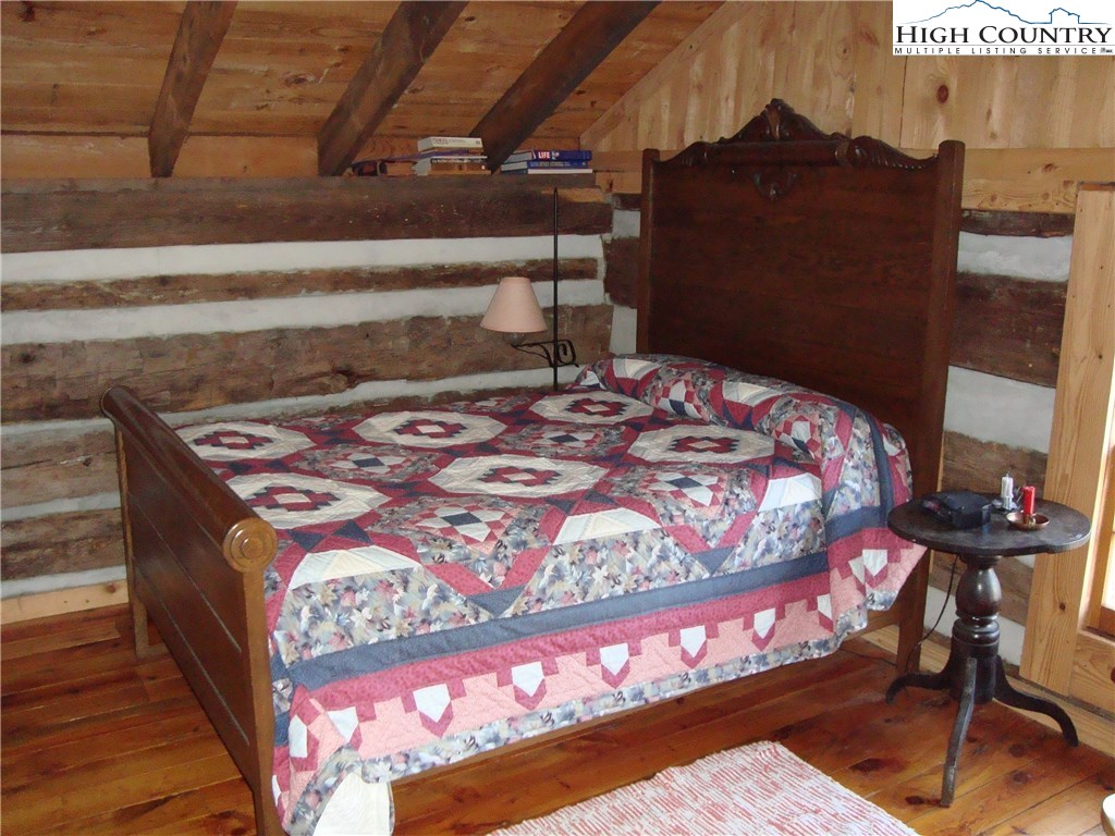 4360 Stones Chapel Road Elk Creek, VA 24326 - Photo 5 of 21 a bed sitting in a bedroom next to a window
