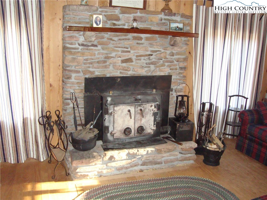 4360 Stones Chapel Road Elk Creek, VA 24326 - Photo 7 of 21 a living room with furniture and a fireplace