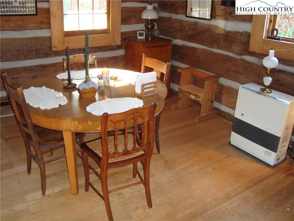 4360 Stones Chapel Road Elk Creek, VA 24326 - Photo 9 of 21 a dining room with furniture and wooden floor