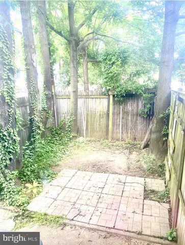 a view of a backyard of the house