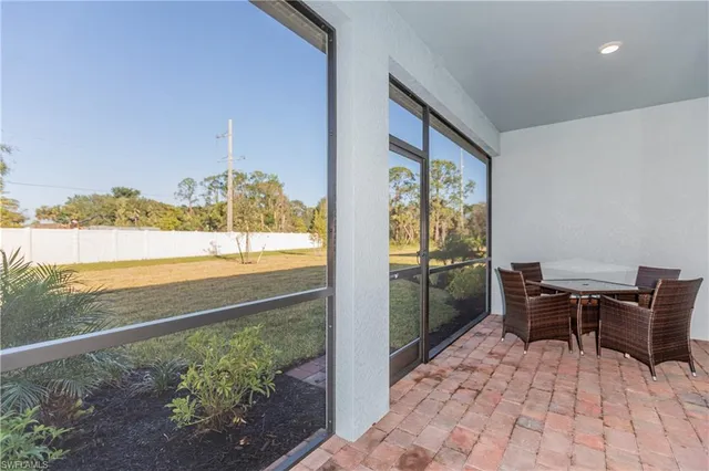 a view of a balcony with chairs