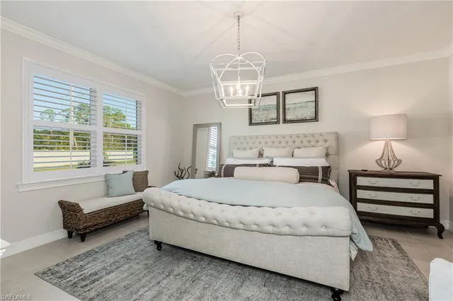 a spacious bedroom with a bed and a couch