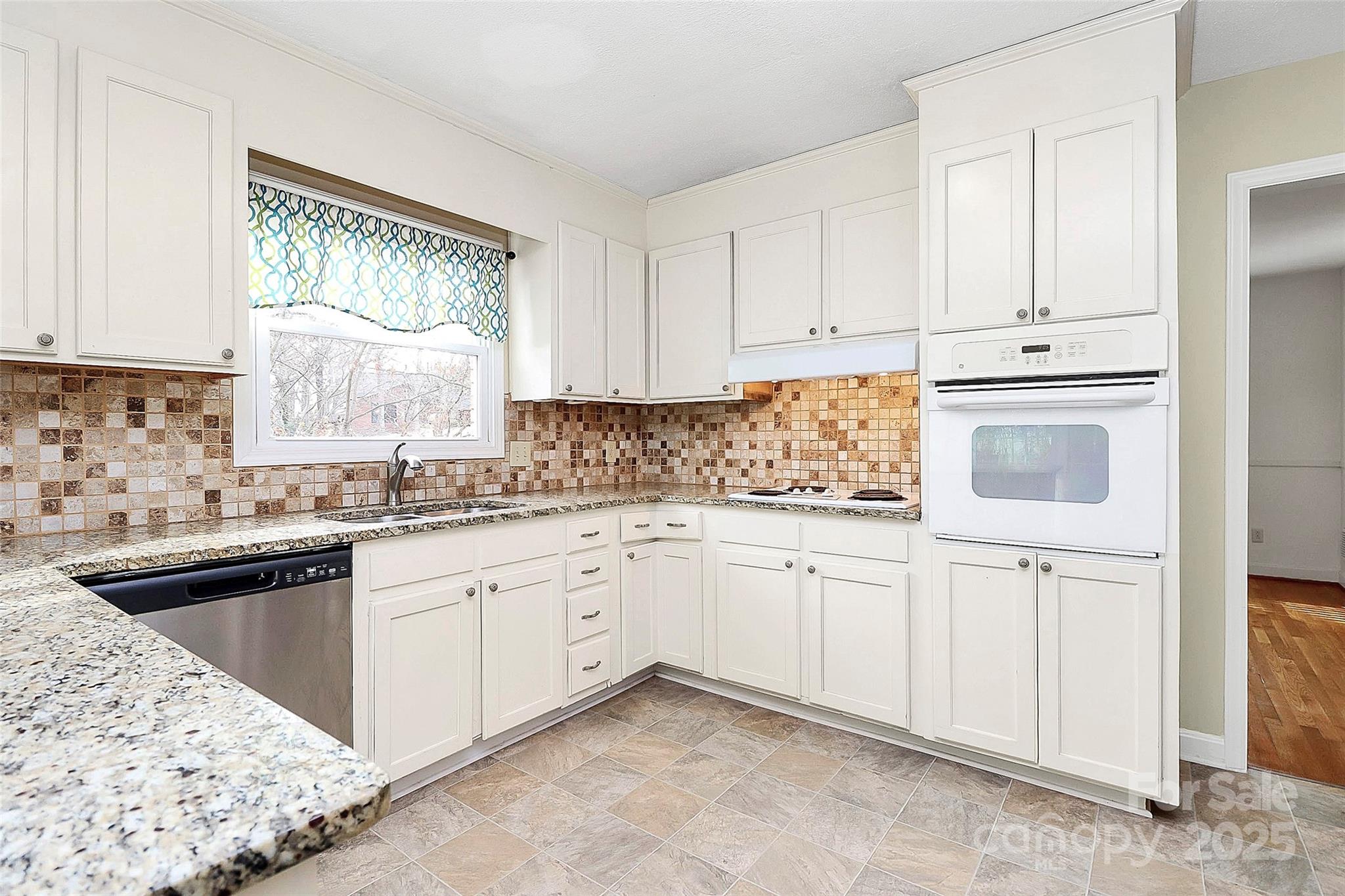 3200 Highview Road Charlotte, NC 28210 - Photo 11 of 48 a kitchen with granite countertop white cabinets and white appliances