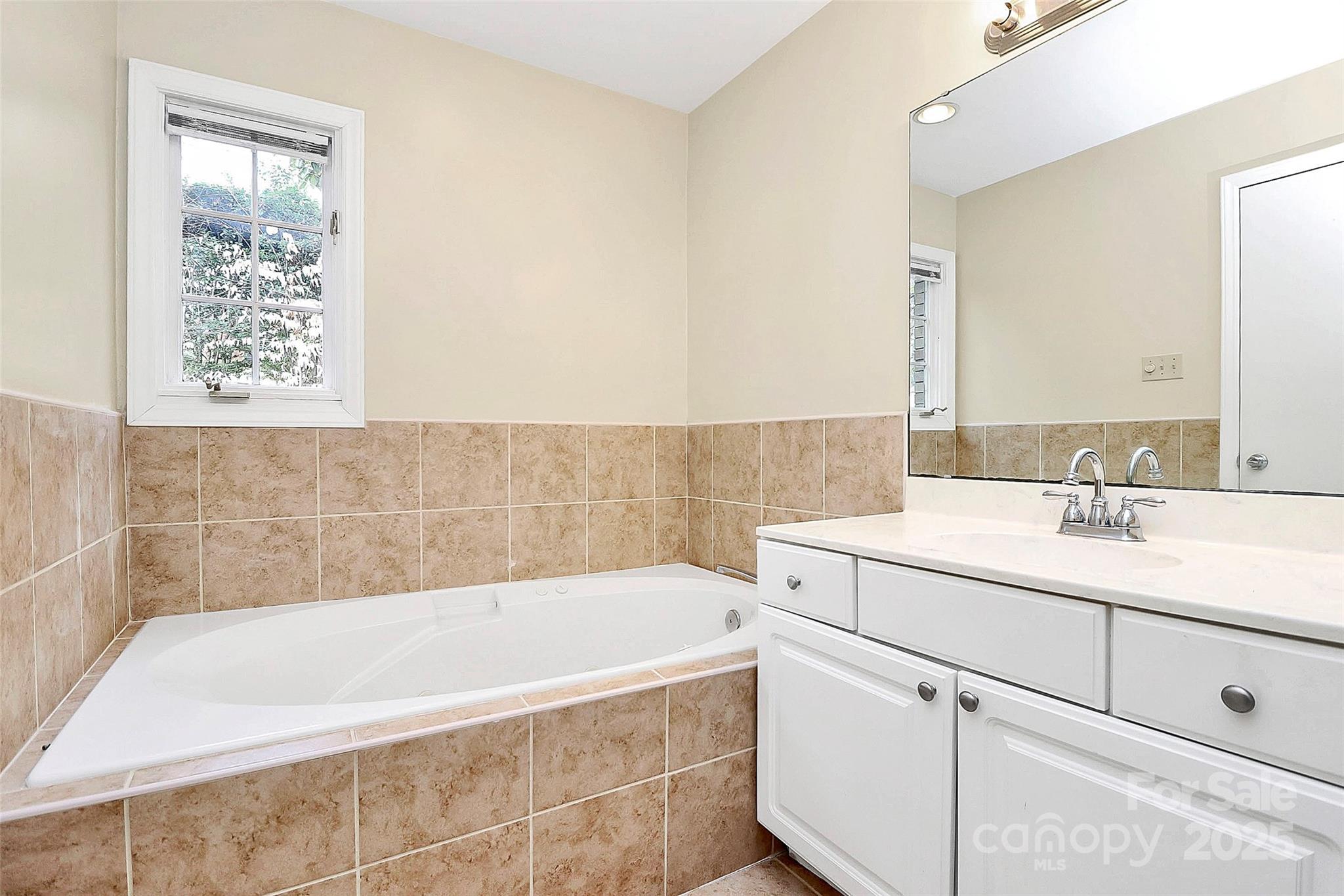 3200 Highview Road Charlotte, NC 28210 - Photo 27 of 48 a bathroom with a tub sink and mirror
