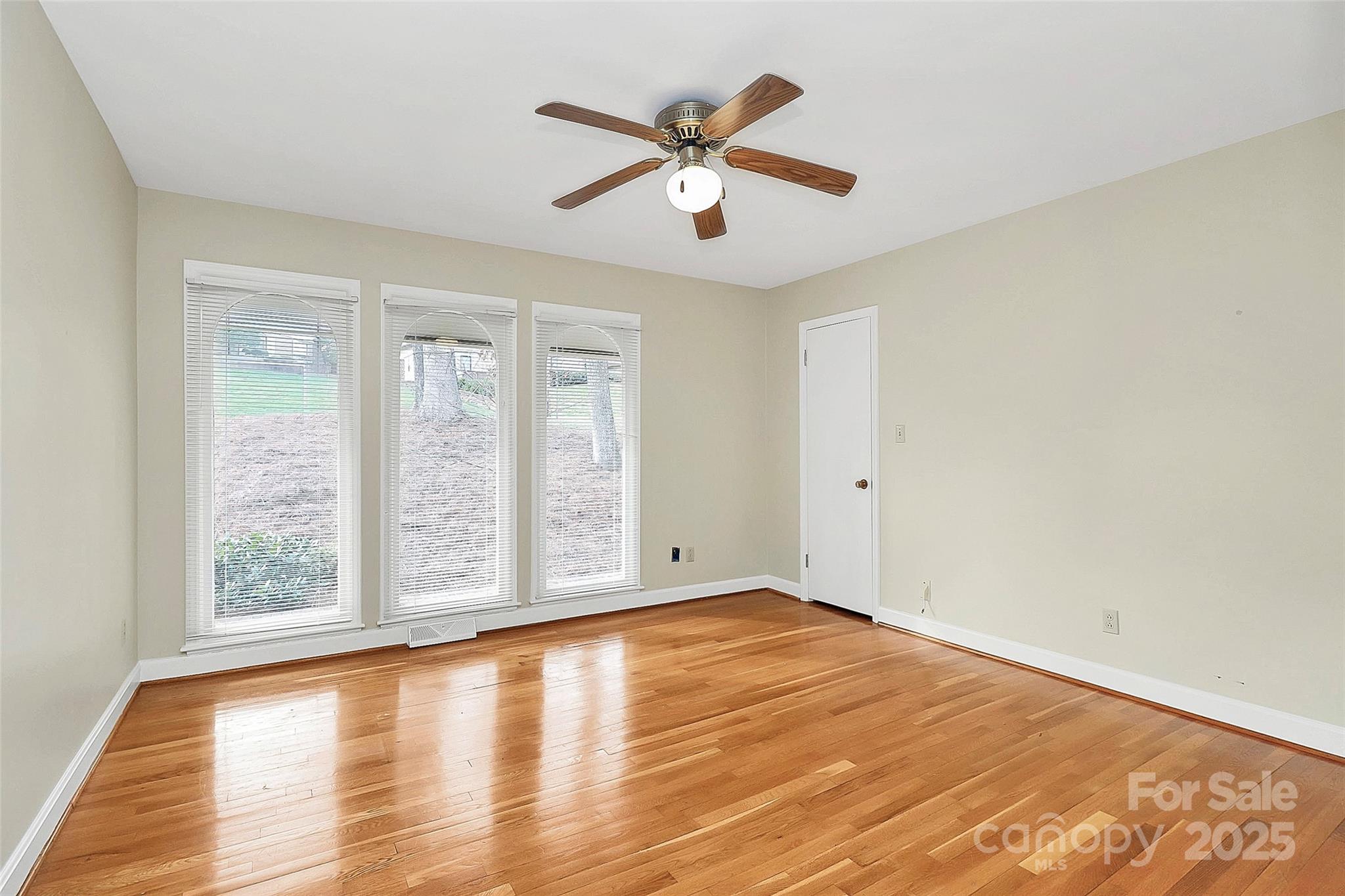 3200 Highview Road Charlotte, NC 28210 - Photo 28 of 48 an empty room with wooden floor and windows