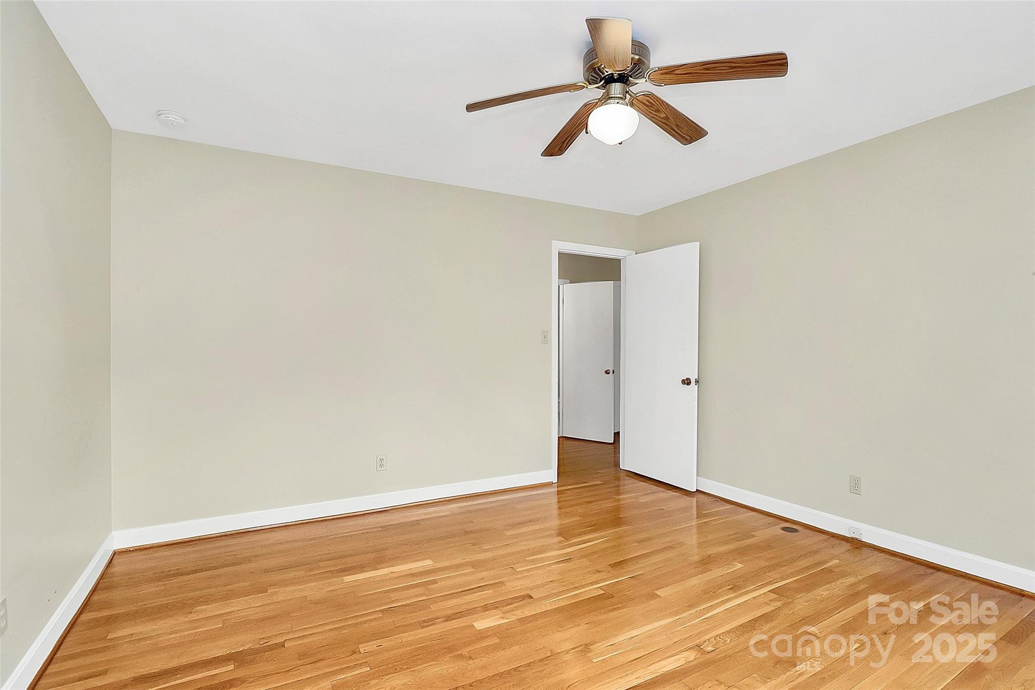 3200 Highview Road Charlotte, NC 28210 - Photo 29 of 48 an empty room with wooden floor and windows