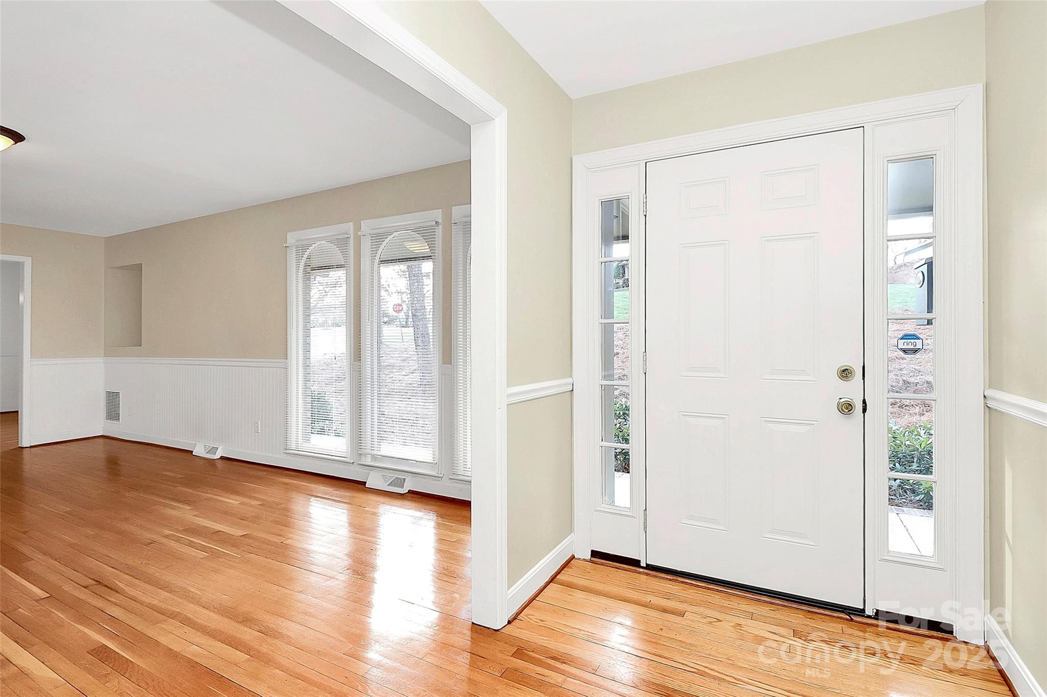 3200 Highview Road Charlotte, NC 28210 - Photo 3 of 48 a view of an empty room with wooden floor and a window
