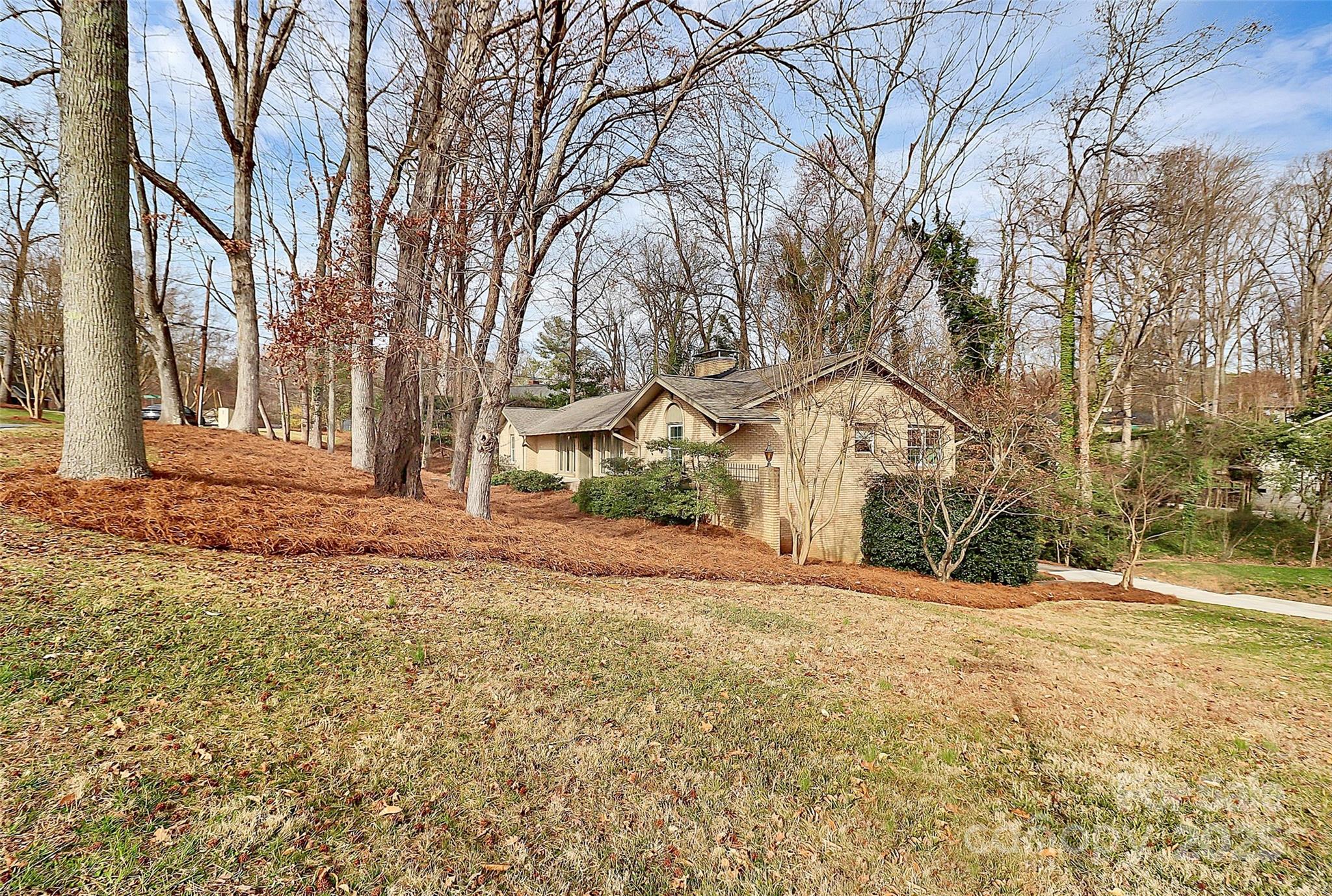 3200 Highview Road Charlotte, NC 28210 - Photo 39 of 48 a view of a white house with a yard covered with snow