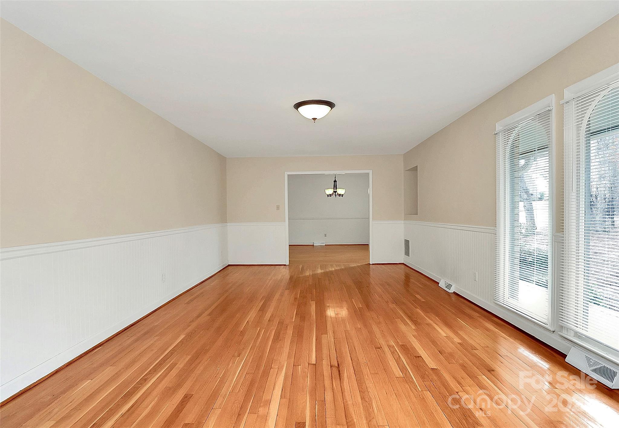 3200 Highview Road Charlotte, NC 28210 - Photo 4 of 48 a view of empty room with wooden floor and fan
