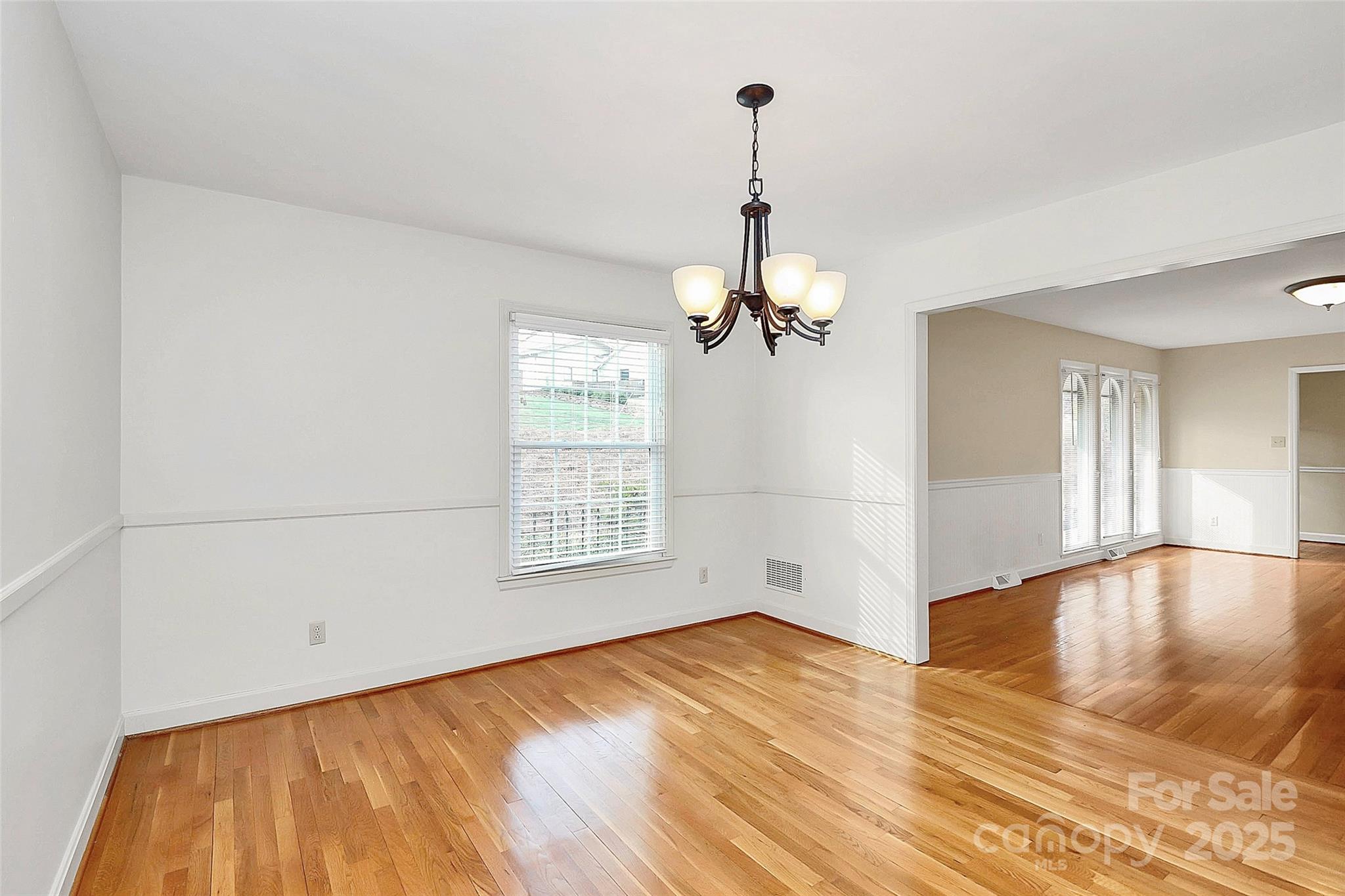 3200 Highview Road Charlotte, NC 28210 - Photo 6 of 48 a view of empty room with wooden floor and fan
