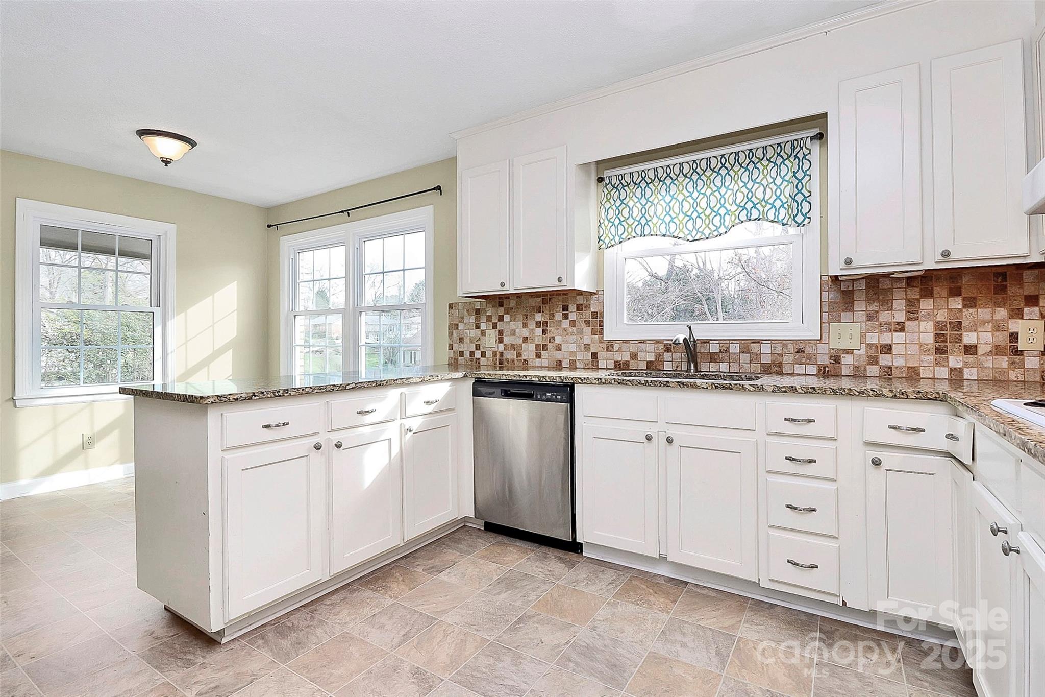 3200 Highview Road Charlotte, NC 28210 - Photo 8 of 48 a kitchen with granite countertop white cabinets white appliances with a sink and dishwasher