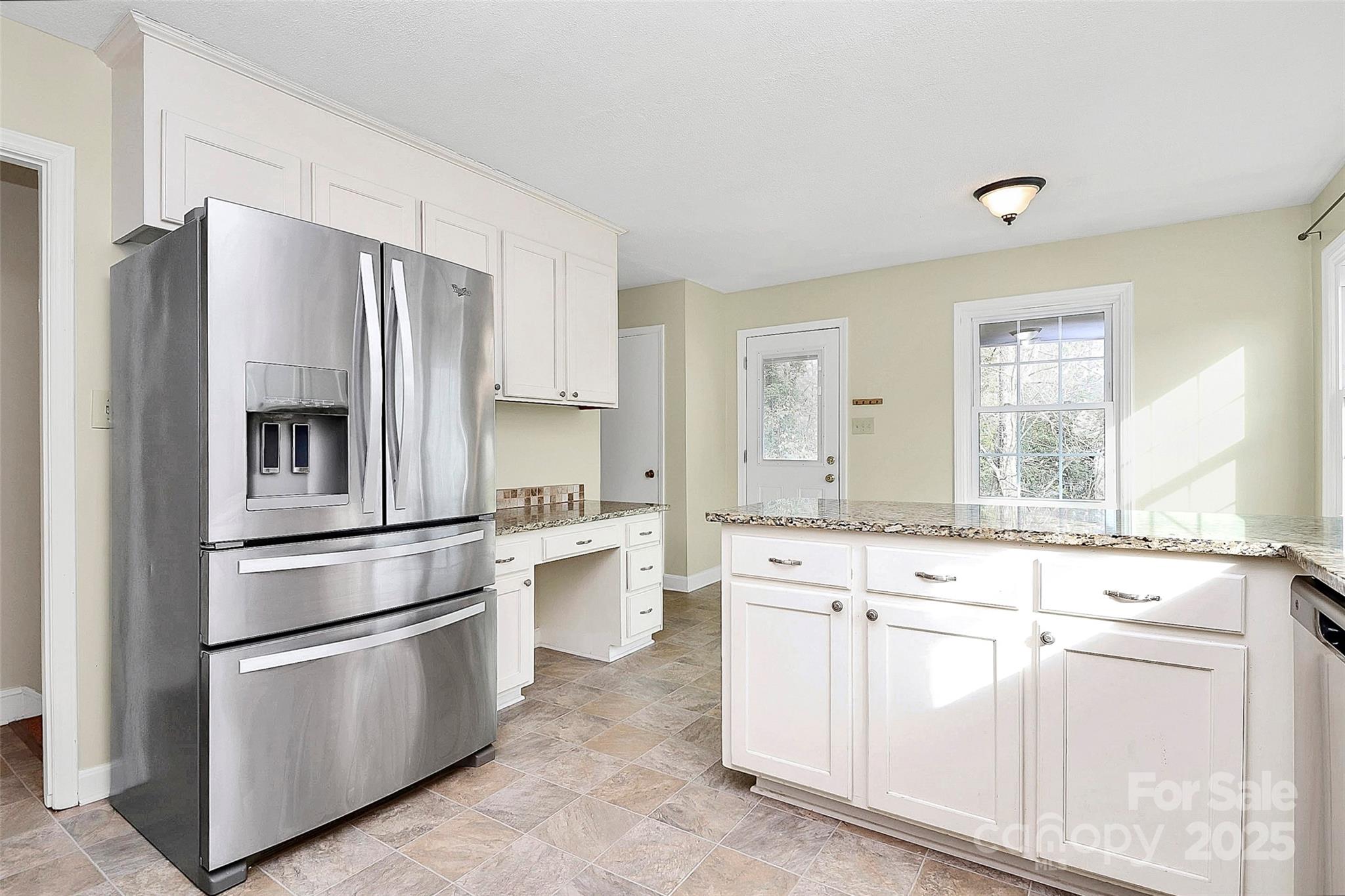 3200 Highview Road Charlotte, NC 28210 - Photo 9 of 48 a kitchen with white cabinets and stainless steel appliances