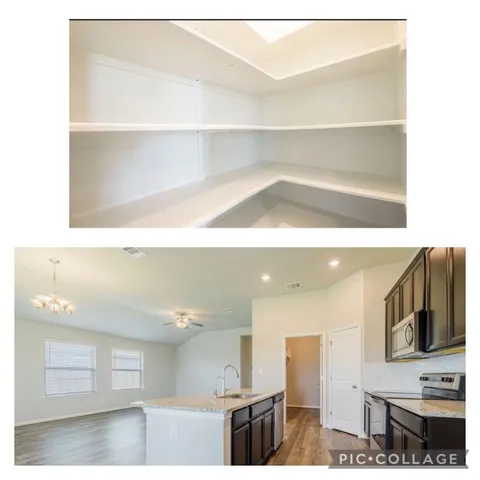 a view of kitchen with cabinets and microwave
