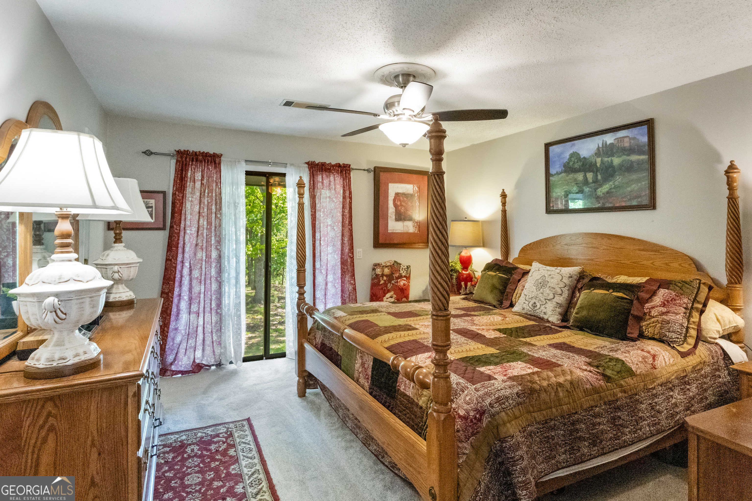 1509 High Point Road Bowdon, GA 30108 - Photo 22 of 33 a bedroom with a bed and wooden floor
