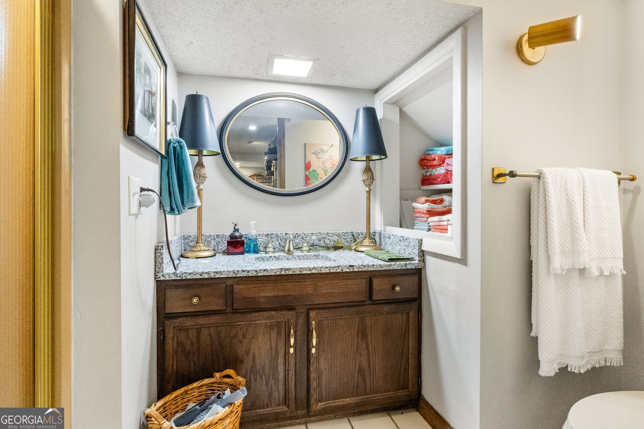 1509 High Point Road Bowdon, GA 30108 - Photo 25 of 33 a bathroom with a sink and a mirror