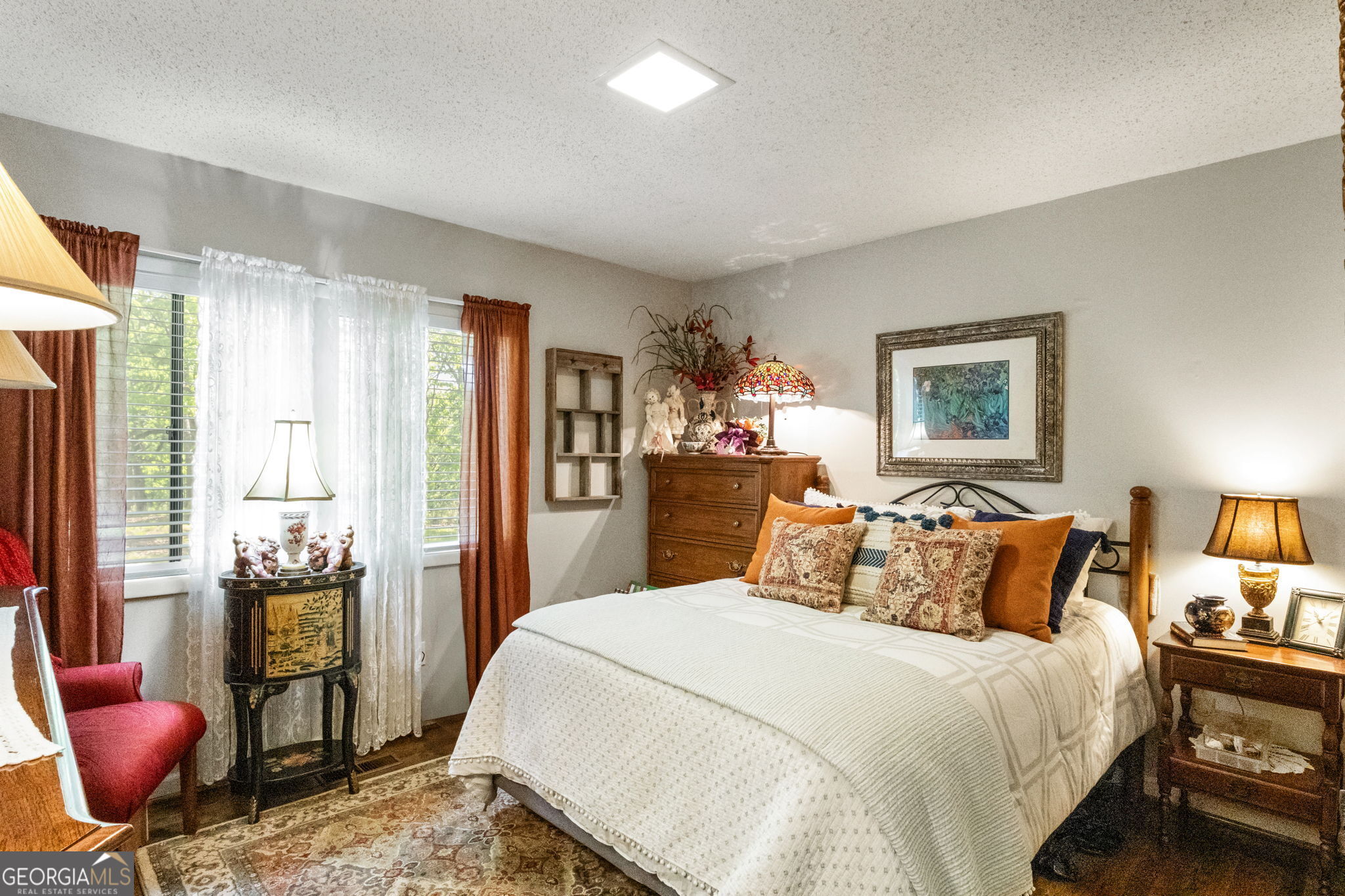 1509 High Point Road Bowdon, GA 30108 - Photo 28 of 33 a bedroom with a bed and wooden floor