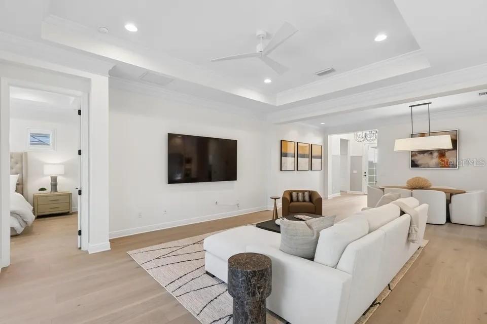 7346 Edenmore Street Lakewood Ranch, FL 34202 - Photo 14 of 70 a living room with furniture and a flat screen tv