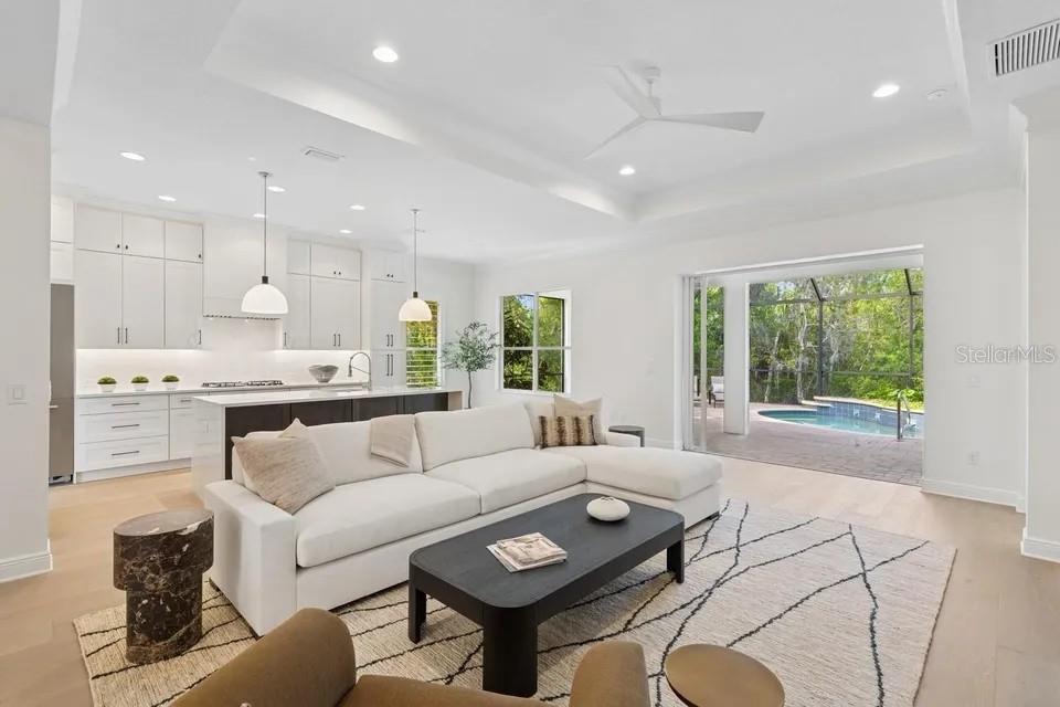 7346 Edenmore Street Lakewood Ranch, FL 34202 - Photo 22 of 70 a living room with furniture and a large window