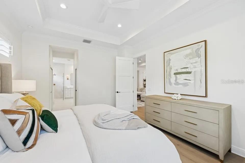 7346 Edenmore Street Lakewood Ranch, FL 34202 - Photo 29 of 70 a bedroom with a bed and a dresser