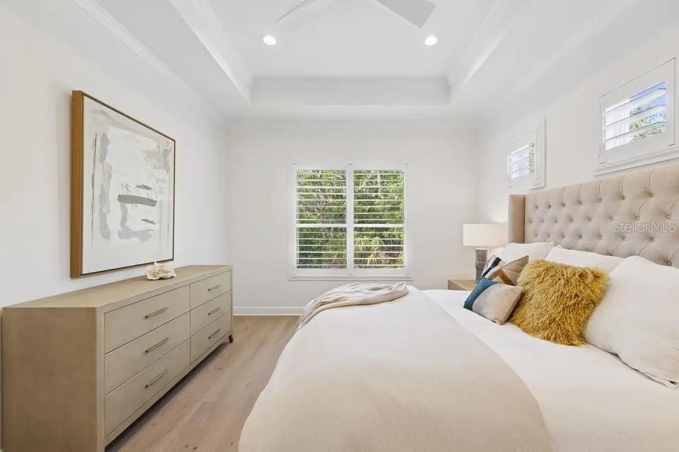 7346 Edenmore Street Lakewood Ranch, FL 34202 - Photo 30 of 70 a bedroom with a bed and a window