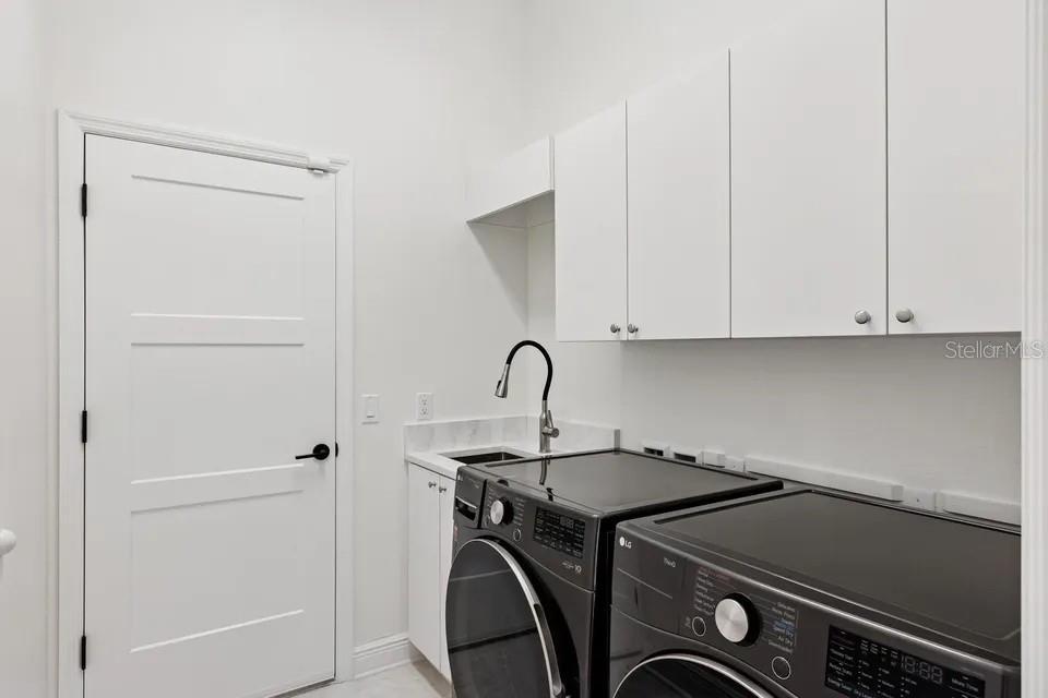 7346 Edenmore Street Lakewood Ranch, FL 34202 - Photo 37 of 70 a utility room with dryer and washer