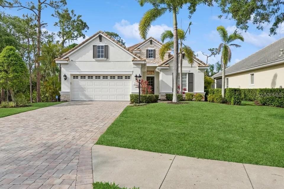 7346 Edenmore Street Lakewood Ranch, FL 34202 - Photo 42 of 70 a view of house with garden