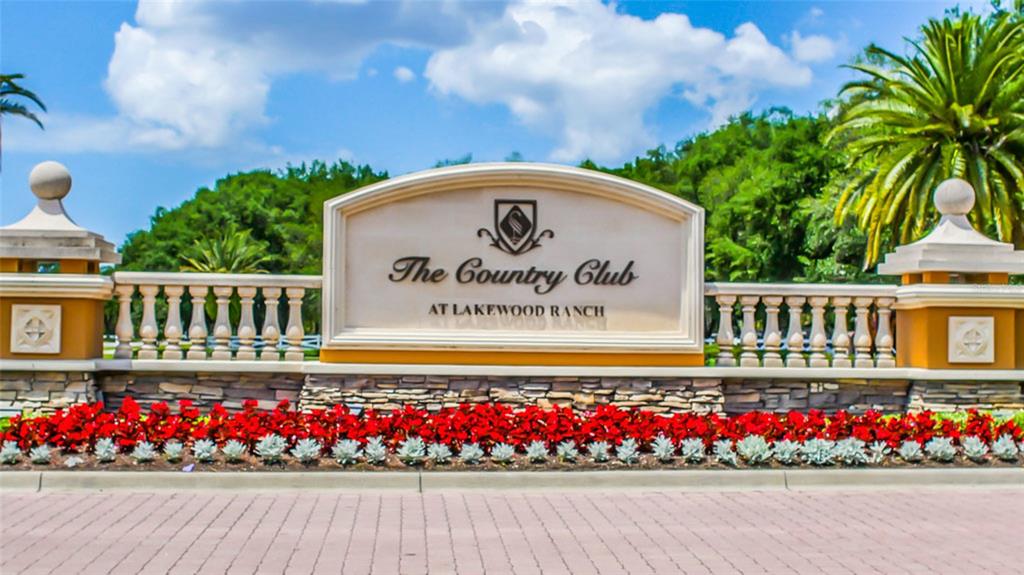 7346 Edenmore Street Lakewood Ranch, FL 34202 - Photo 44 of 70 a view of sign board with flower around